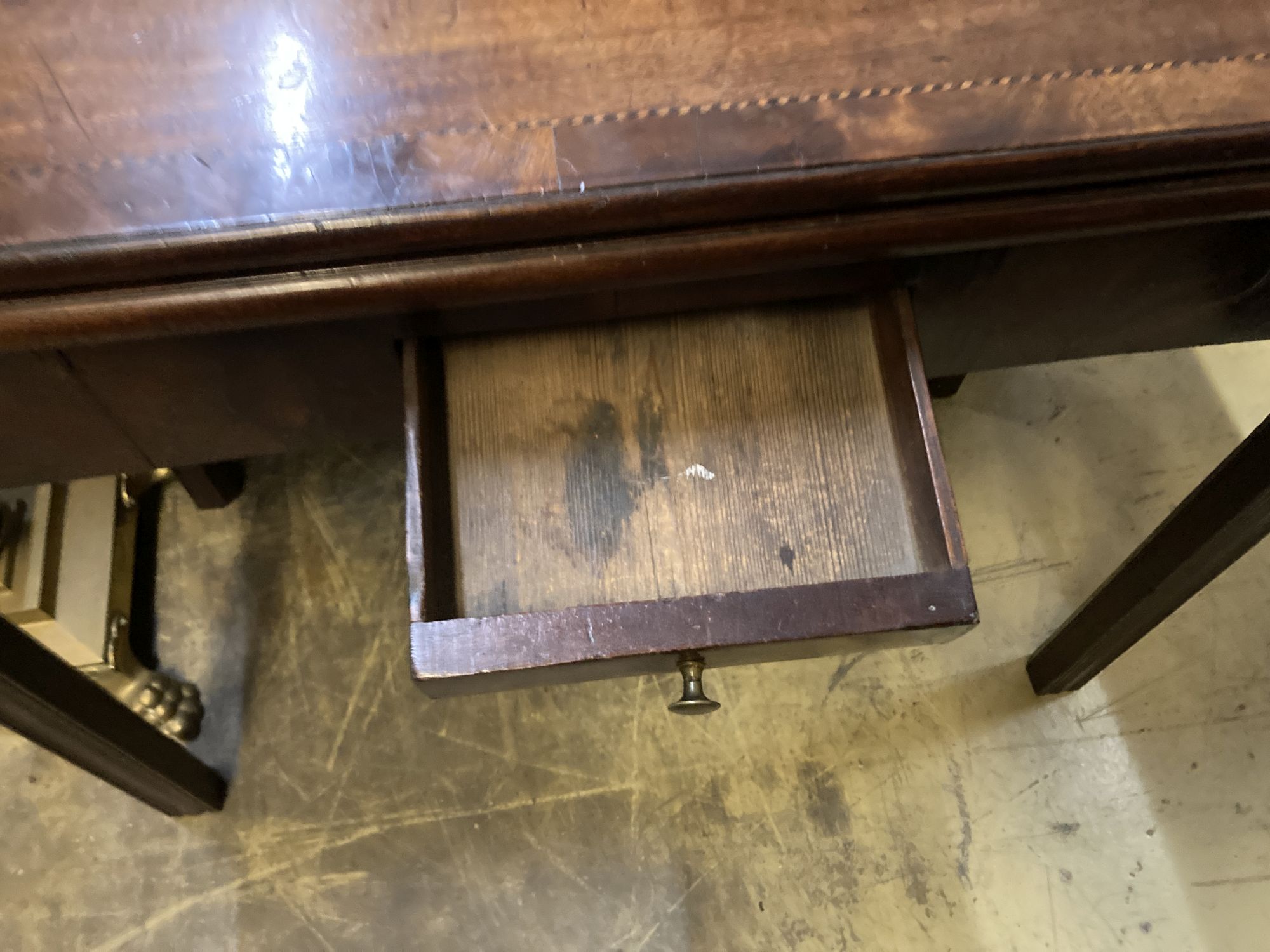A George III rectangular inlaid mahogany folding card table, width 88cm, depth 41cm, height 73cm
